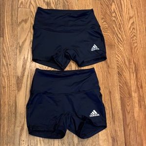 Two pairs of Adidas dark blue athletic shorts